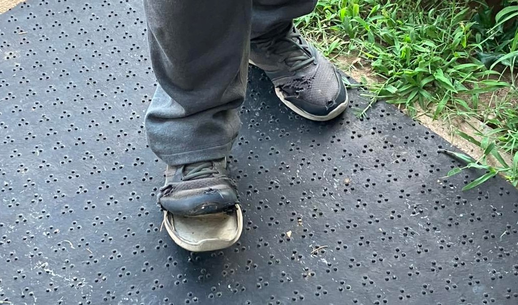 man with broken shoes